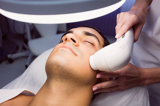 Man having a facial treatment at Luminous